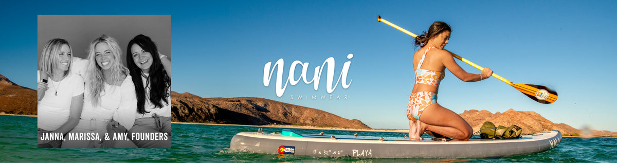 A promotional banner featuring a woman in a white patterned bikini kneeling on a paddleboard on turquoise water with rocky mountains in the background. A black-and-white inset photo on the left shows three women, with the names Jana, Marissa, and Amy, founders, printed below.