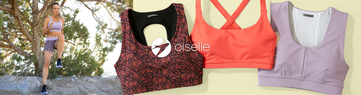 Three women's sports bra styles displayed side by side on a pale yellow background, with a model wearing a patterned sports bra visible on the left. The bras include a black and red geometric pattern, a coral orange with crisscross straps, and a light lavender solid color.