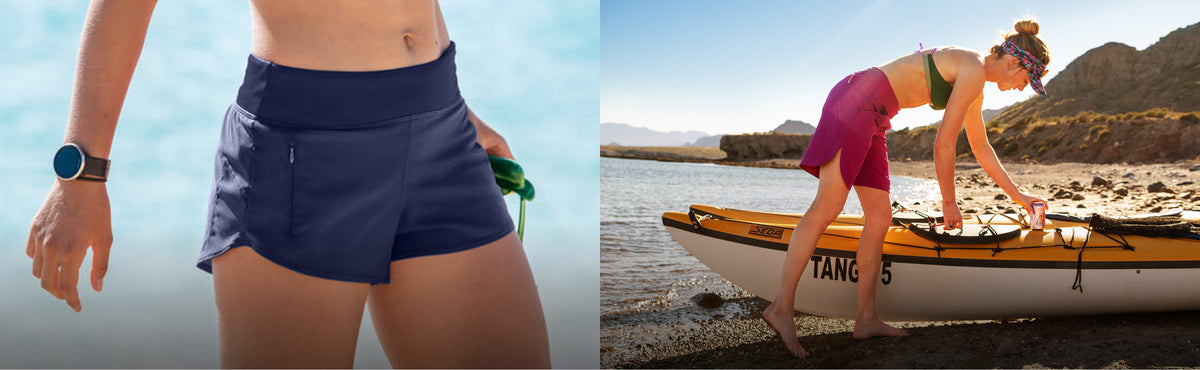 A split-screen lifestyle image showing a woman wearing navy blue athletic shorts on a beach. On the left, she is cropped from the waist down, wearing the navy shorts and a smartwatch.